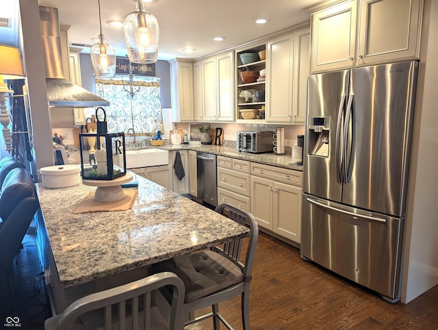3236 Spruce St, Columbus, IN 47203 - kitchen featuring stainless steel appliances, open shelves, dark wood-style flooring, light stone countertops, and a peninsula