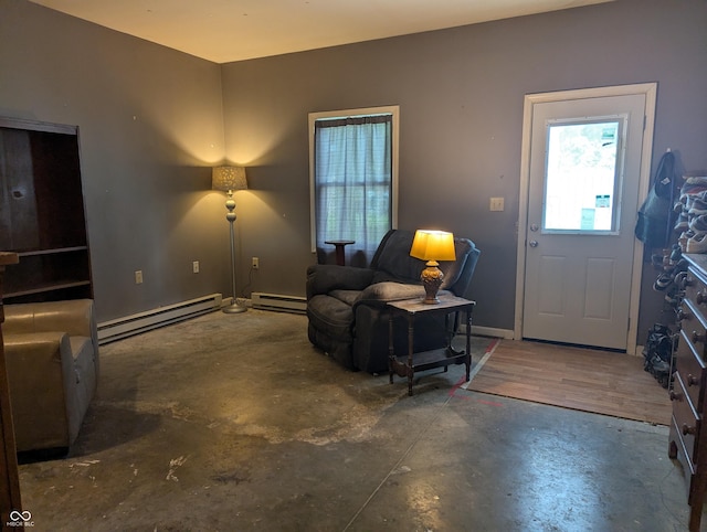3236 Spruce St, Columbus, IN 47203 - foyer entrance with baseboard heating and unfinished concrete flooring