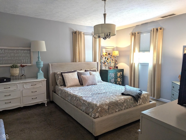 3236 Spruce St, Columbus, IN 47203 - carpeted bedroom with a textured ceiling
