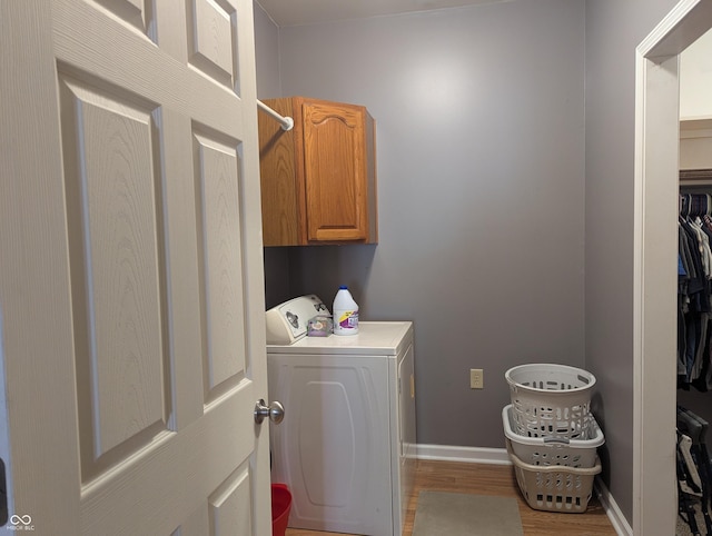 3236 Spruce St, Columbus, IN 47203 - washroom with cabinet space and wood finished floors