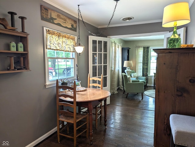 3236 Spruce St, Columbus, IN 47203 - dining room with plenty of natural light, ornamental molding, and dark wood-style floors