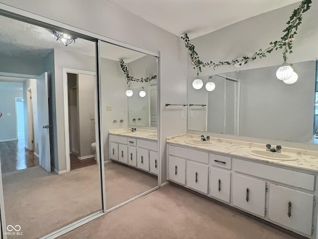 2975 Two Worlds Dr, Columbus, IN 47201 - bathroom featuring double vanity and toilet