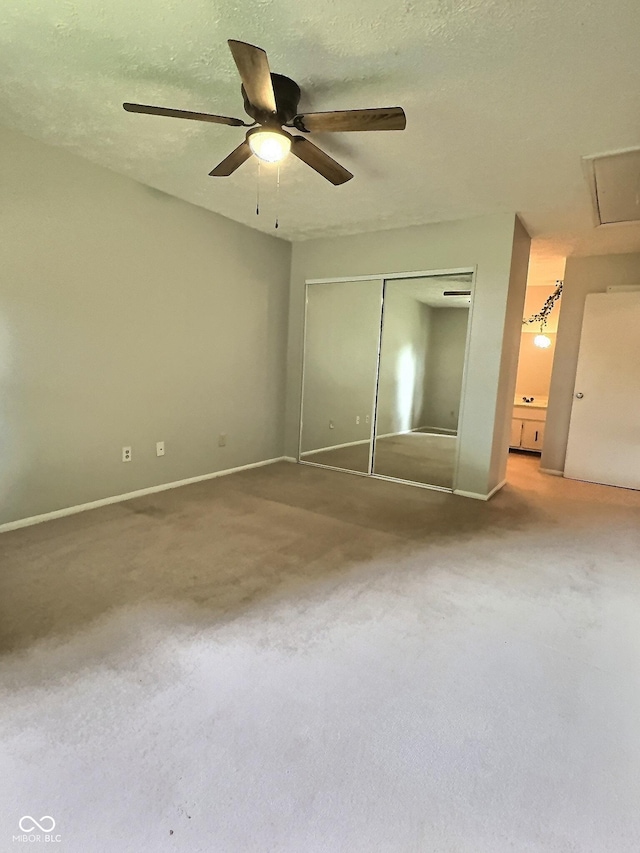 2975 Two Worlds Dr, Columbus, IN 47201 - unfurnished bedroom with a closet, carpet, a ceiling fan, and attic access