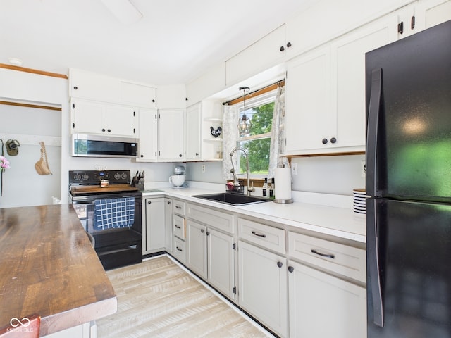5282 W 900 N, Frankton, IN 46044 - kitchen featuring black appliances, white cabinets, light wood finished floors, and open shelves