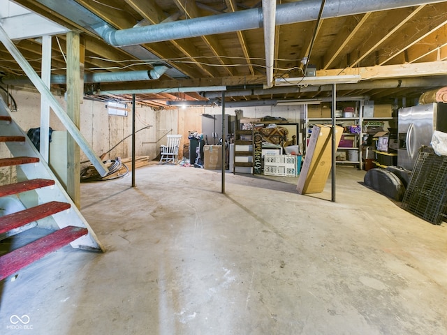 5282 W 900 N, Frankton, IN 46044 - unfinished basement featuring stainless steel fridge with ice dispenser and stairway