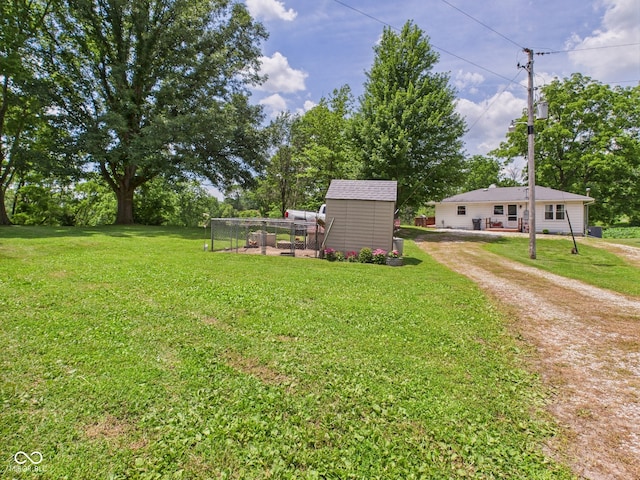 5282 W 900 N, Frankton, IN 46044 - view of grassy yard featuring a shed and driveway