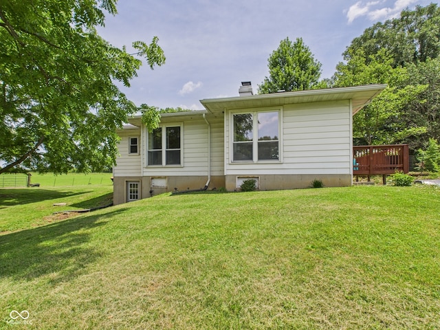 5282 W 900 N, Frankton, IN 46044 - rear view of house with a chimney, a yard, and a wooden deck