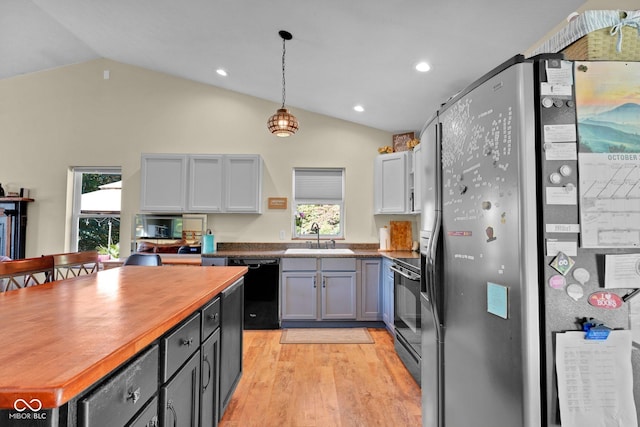 9970 N Brown Ln, Gosport, IN 47433 - kitchen with black appliances, vaulted ceiling, light wood-style floors, recessed lighting, and butcher block counters