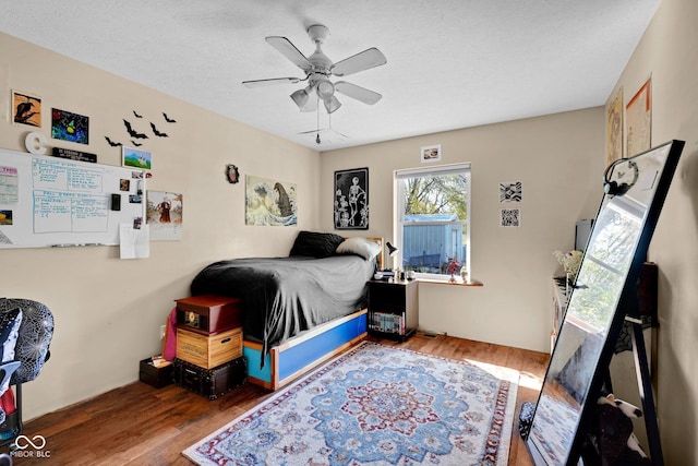 9970 N Brown Ln, Gosport, IN 47433 - bedroom with wood finished floors and ceiling fan