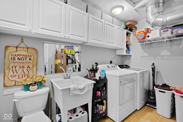 9970 N Brown Ln, Gosport, IN 47433 - laundry area with washing machine and dryer, electric water heater, and cabinet space