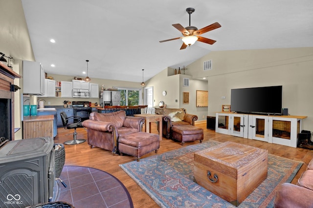 9970 N Brown Ln, Gosport, IN 47433 - living area with vaulted ceiling, a ceiling fan, light wood finished floors, and recessed lighting
