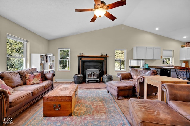 9970 N Brown Ln, Gosport, IN 47433 - living room featuring a wood stove, wood finished floors, a ceiling fan, vaulted ceiling, and recessed lighting