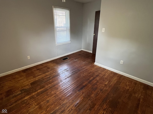 1726 N Linwood Ave, Indianapolis, IN 46218 - empty room featuring baseboards and wood finished floors