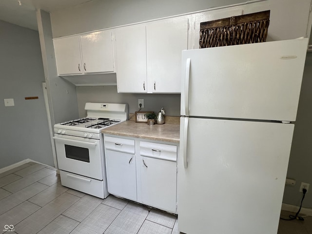 1726 N Linwood Ave, Indianapolis, IN 46218 - kitchen featuring white appliances, light countertops, white cabinets, and under cabinet range hood