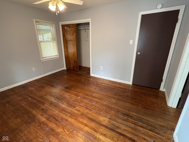1726 N Linwood Ave, Indianapolis, IN 46218 - unfurnished bedroom with dark wood-style floors, a closet, and a ceiling fan