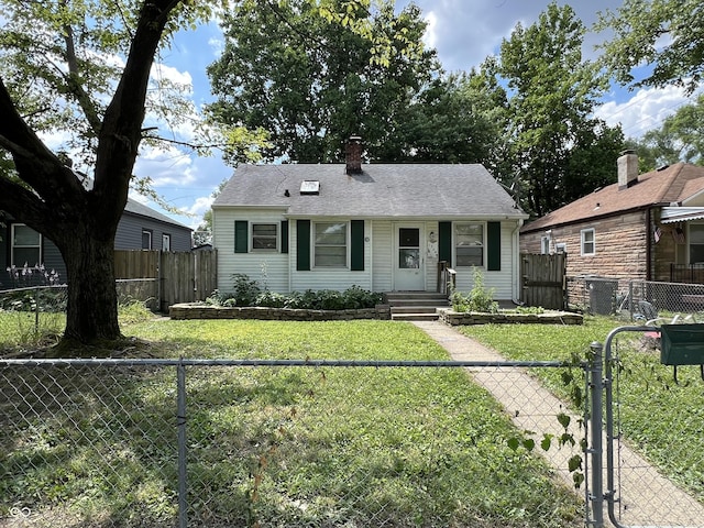 1726 N Linwood Ave, Indianapolis, IN 46218 - view of front of house with a gate, a chimney, a fenced backyard, and roof with shingles