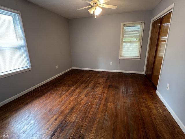 1726 N Linwood Ave, Indianapolis, IN 46218 - unfurnished bedroom with dark wood-style flooring and baseboards