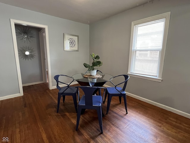 1726 N Linwood Ave, Indianapolis, IN 46218 - dining room with dark wood-style floors and baseboards