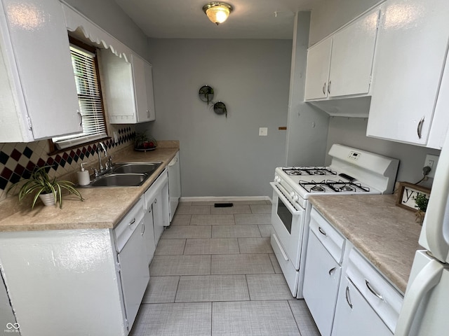 1726 N Linwood Ave, Indianapolis, IN 46218 - kitchen featuring white appliances, white cabinetry, light countertops, light tile patterned floors, and backsplash