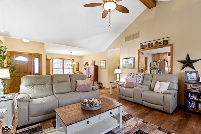 1530 Danaher St, Indianapolis, IN 46217 - living area featuring a chandelier, ceiling fan, wood finished floors, high vaulted ceiling, and beamed ceiling