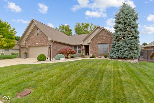 1530 Danaher St, Indianapolis, IN 46217 - view of front of home with brick siding, driveway, a shingled roof, and an attached garage