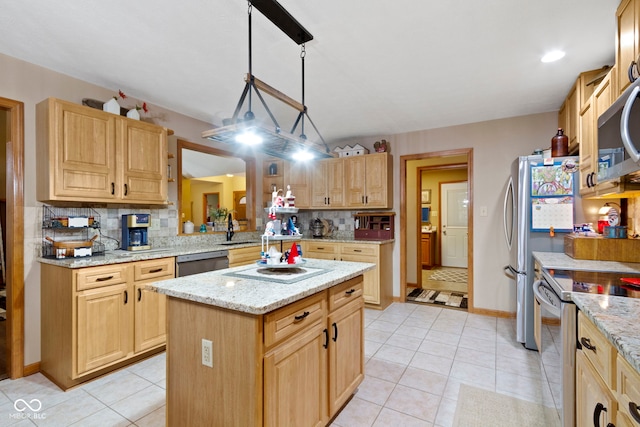 1530 Danaher St, Indianapolis, IN 46217 - kitchen with appliances with stainless steel finishes, backsplash, light brown cabinetry, a kitchen island, and light tile patterned flooring