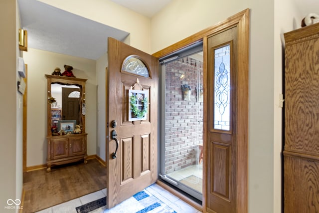 1530 Danaher St, Indianapolis, IN 46217 - entrance foyer with light wood-style flooring and baseboards