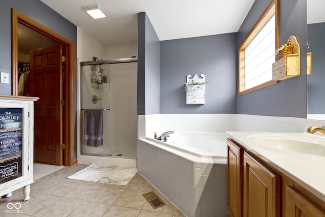1530 Danaher St, Indianapolis, IN 46217 - bathroom with a stall shower, a garden tub, vanity, and tile patterned flooring