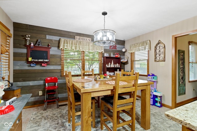 1530 Danaher St, Indianapolis, IN 46217 - dining space featuring a chandelier and wooden walls