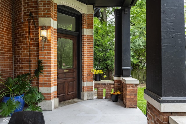 5631 University Ave, Indianapolis, IN 46219 - doorway to property featuring brick siding and a porch