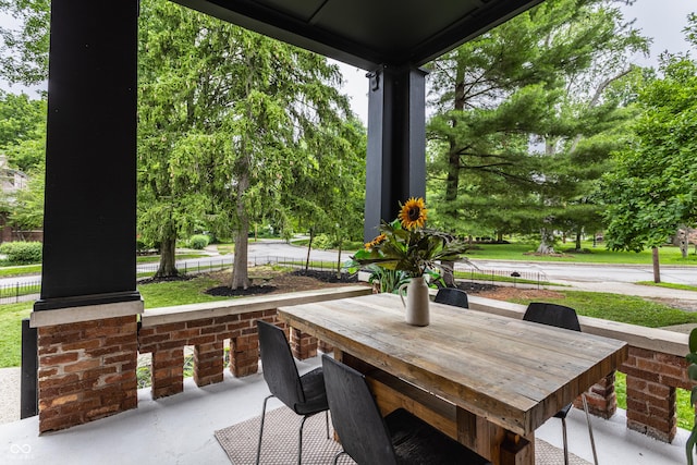 5631 University Ave, Indianapolis, IN 46219 - covered porch with outdoor dining area