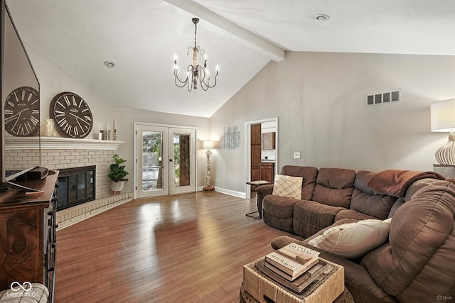 3191 W 246th St, Sheridan, IN 46069 - living room with a chandelier, beam ceiling, wood finished floors, a fireplace, and high vaulted ceiling