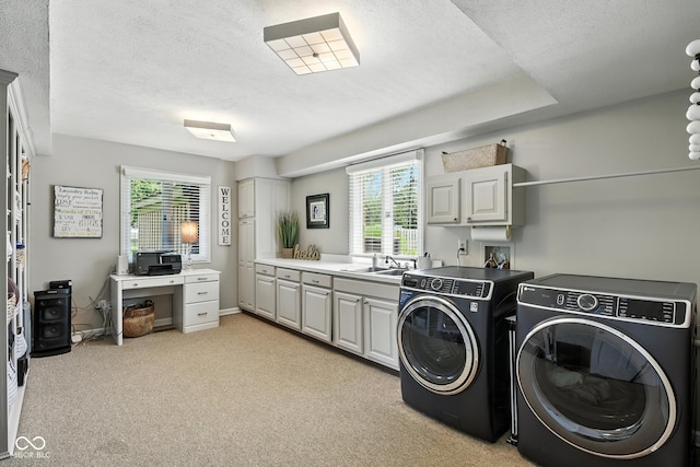 3191 W 246th St, Sheridan, IN 46069 - laundry area with washing machine and clothes dryer, cabinet space, a textured ceiling, and light colored carpet