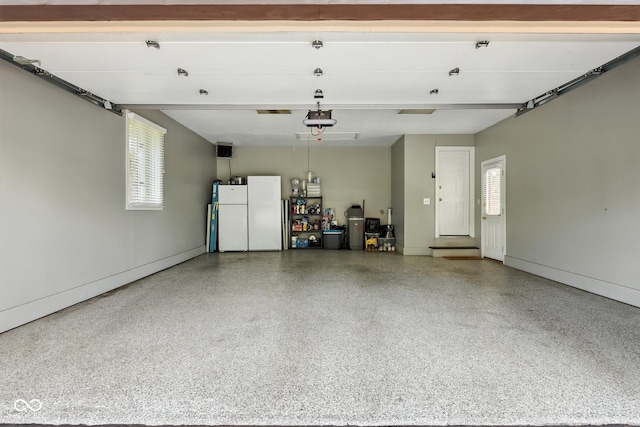 3191 W 246th St, Sheridan, IN 46069 - garage with freestanding refrigerator and a garage door opener