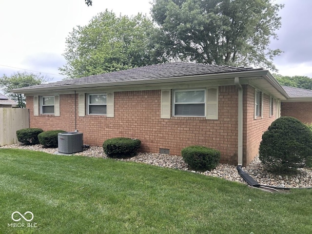 4728 S Eaton Ave, Indianapolis, IN 46239 - view of side of home featuring a central air condition unit and brick siding