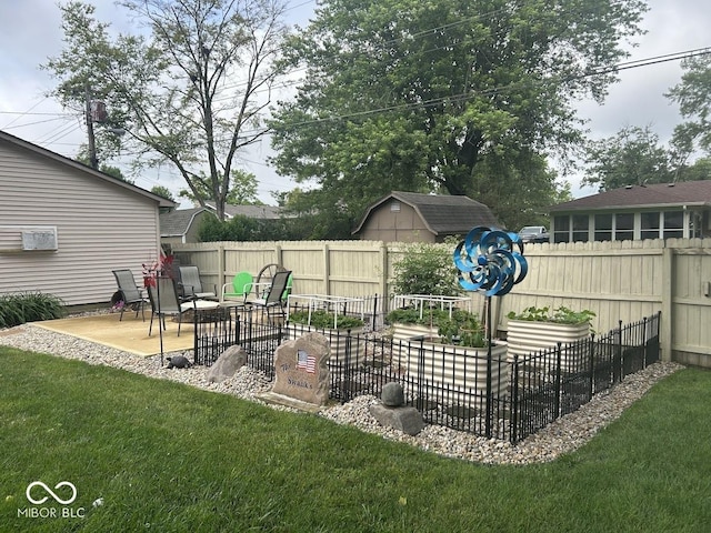 4728 S Eaton Ave, Indianapolis, IN 46239 - fenced backyard featuring a patio and a storage unit