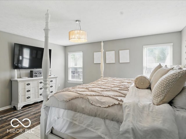 8508 Aviva Ln, Indianapolis, IN 46237 - bedroom with dark wood finished floors and multiple windows