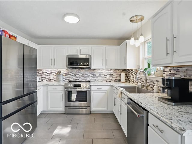 8508 Aviva Ln, Indianapolis, IN 46237 - kitchen featuring appliances with stainless steel finishes, white cabinets, and tasteful backsplash