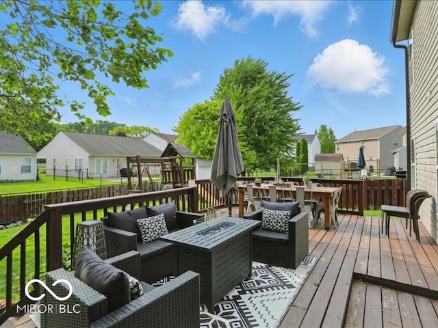 8508 Aviva Ln, Indianapolis, IN 46237 - wooden deck with an outdoor living space with a fire pit, a residential view, and a fenced backyard