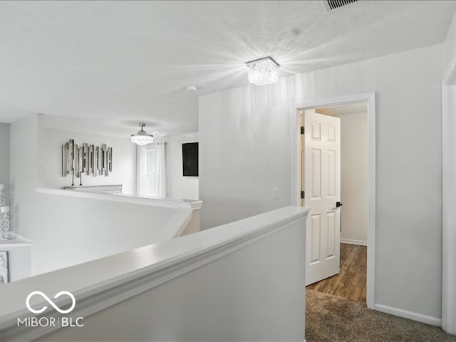 8508 Aviva Ln, Indianapolis, IN 46237 - corridor featuring an upstairs landing and baseboards