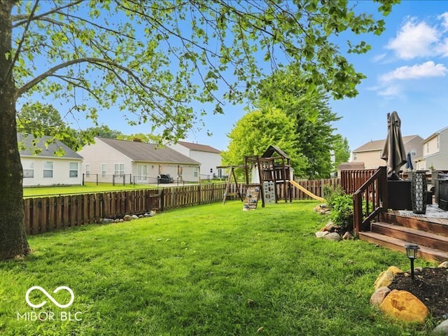 8508 Aviva Ln, Indianapolis, IN 46237 - fenced backyard featuring a residential view and a playground