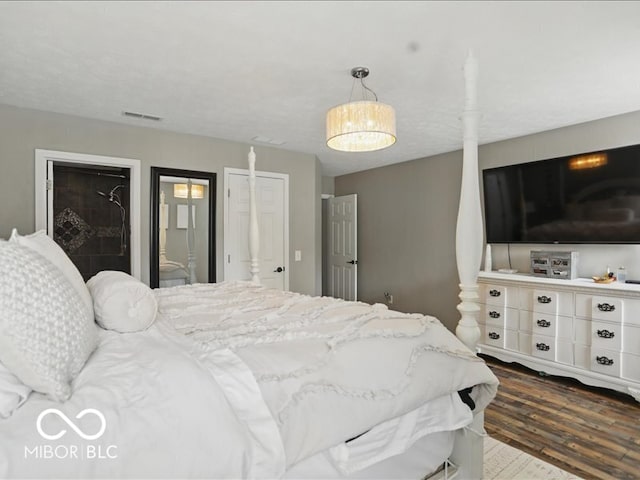 8508 Aviva Ln, Indianapolis, IN 46237 - bedroom featuring dark wood-style flooring, connected bathroom, and a closet