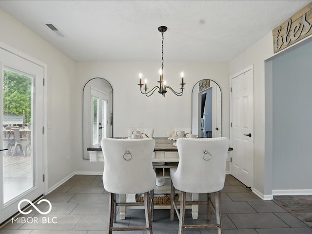 8508 Aviva Ln, Indianapolis, IN 46237 - dining room featuring plenty of natural light, a chandelier, and dark tile patterned floors