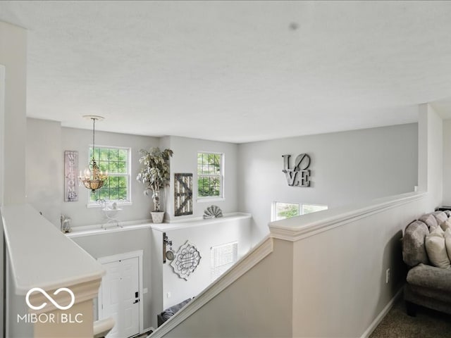 8508 Aviva Ln, Indianapolis, IN 46237 - hall with an upstairs landing and a chandelier