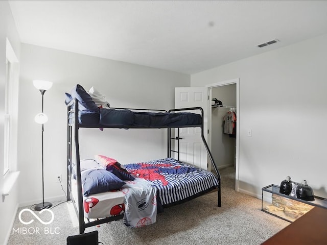 8508 Aviva Ln, Indianapolis, IN 46237 - bedroom featuring carpet flooring and a walk in closet