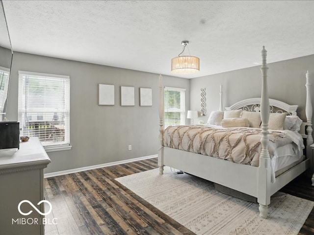 8508 Aviva Ln, Indianapolis, IN 46237 - bedroom with dark wood-style flooring and a textured ceiling