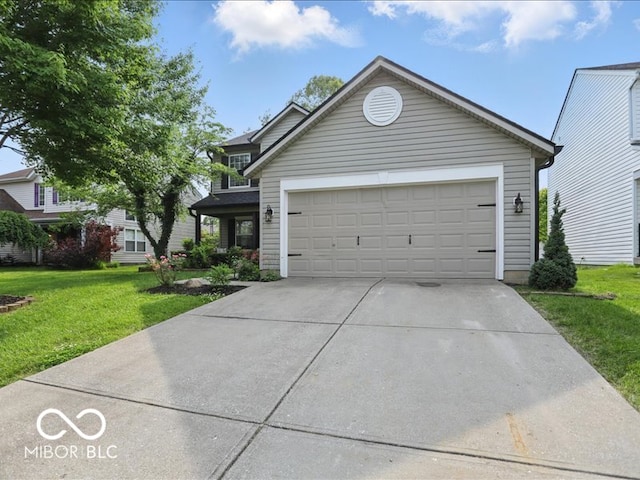 8508 Aviva Ln, Indianapolis, IN 46237 - view of front of house with a front yard, concrete driveway, and a garage