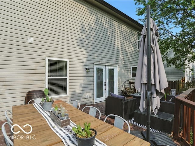 8508 Aviva Ln, Indianapolis, IN 46237 - wooden deck with outdoor dining space, french doors, and an outdoor living space