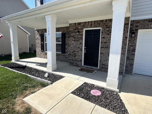 108 Herbert Ct, Trafalgar, IN 46181 - doorway to property featuring a porch and brick siding
