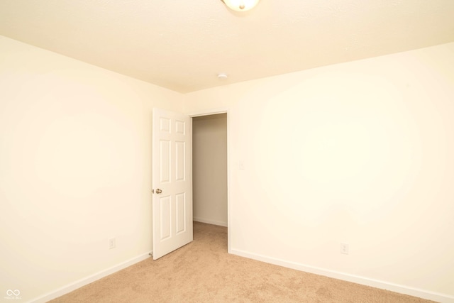 108 Herbert Ct, Trafalgar, IN 46181 - unfurnished room with light colored carpet and a smoke detector